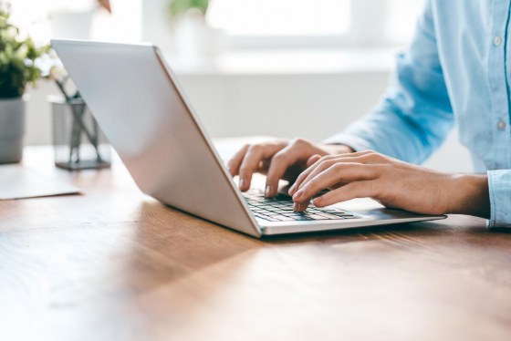 Person typing on a laptop